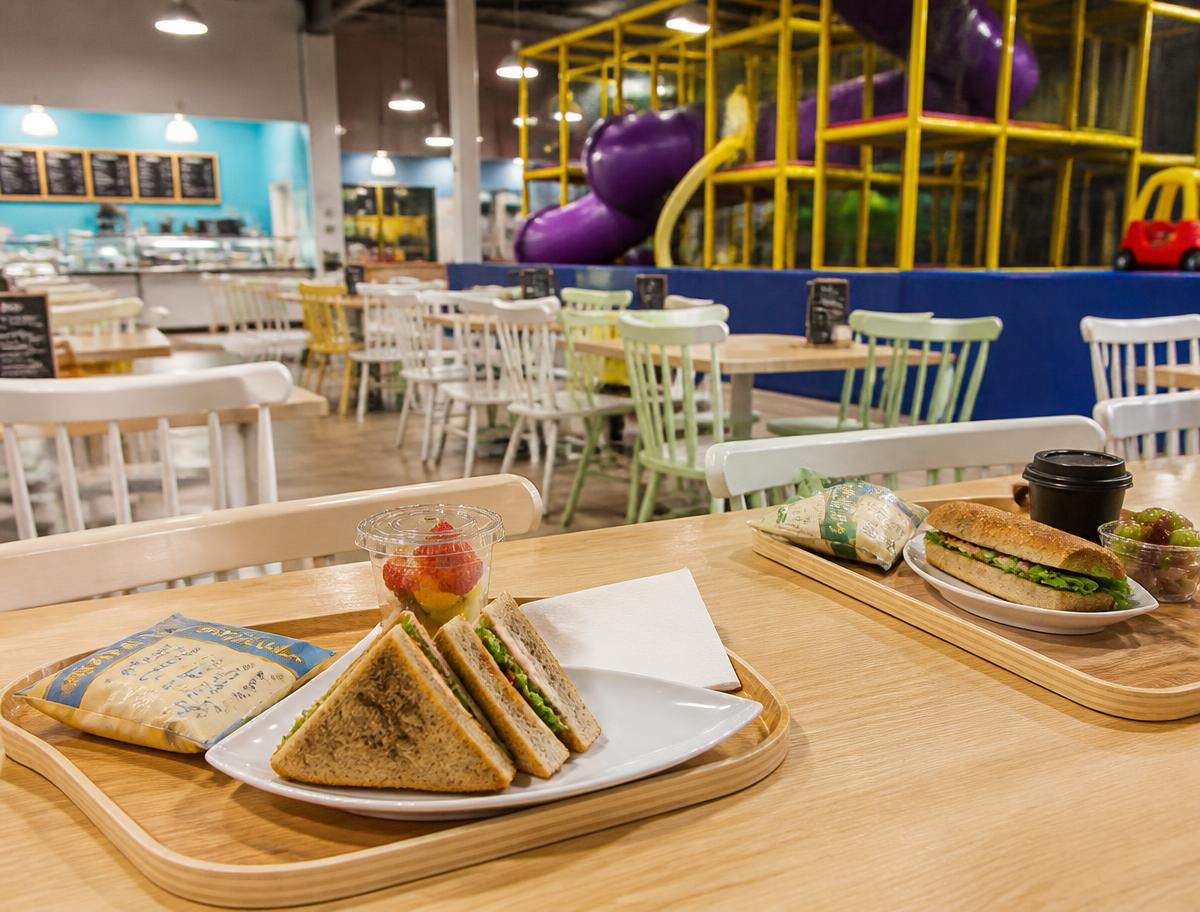Café seating beside the play area